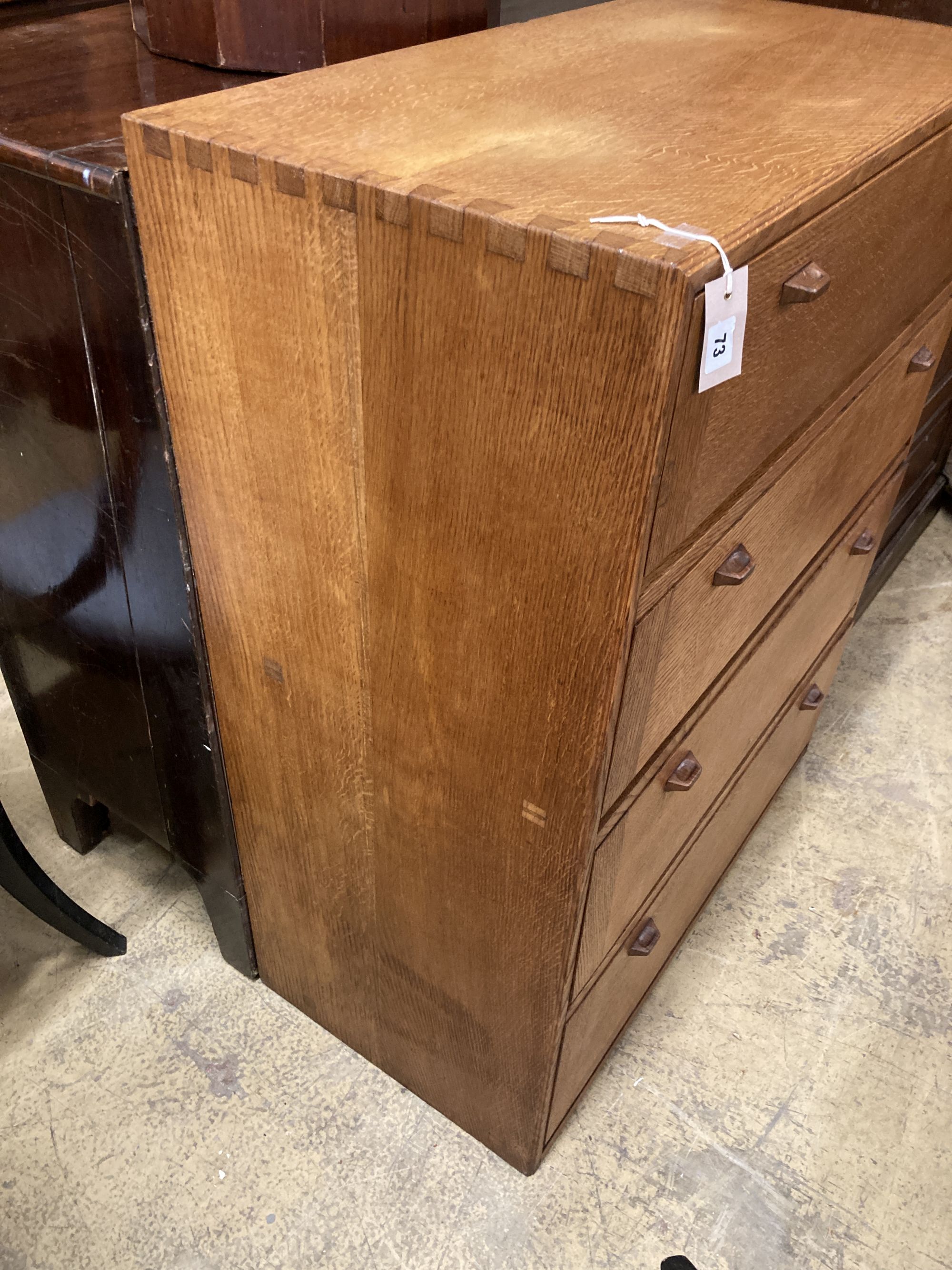 A mid century Cotswolds School oak fall front four division chest, width 91cm, depth 45cm, height 111cm